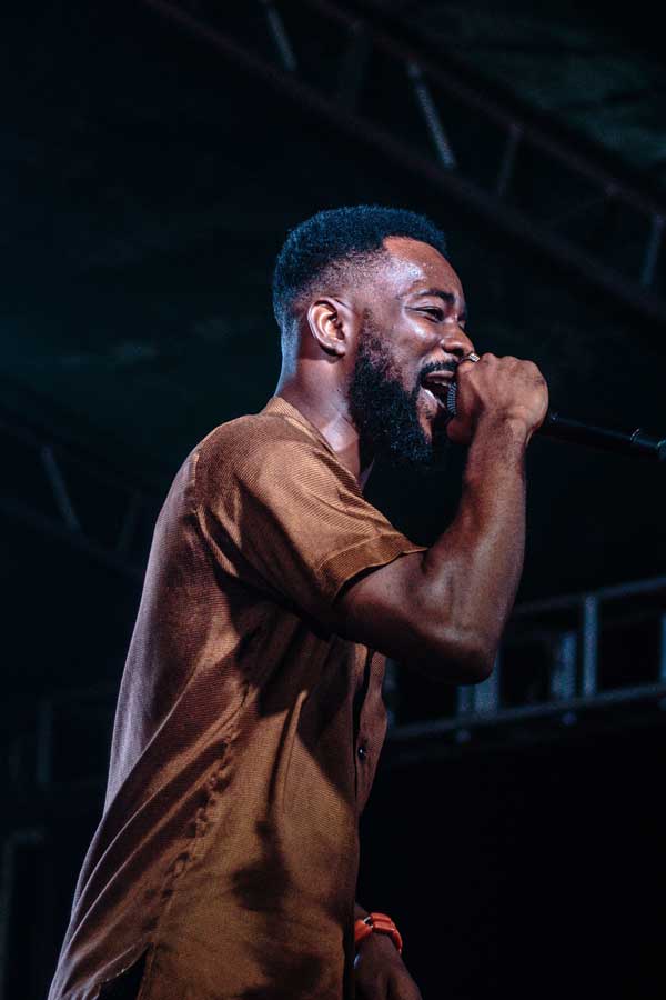 man singing on stage